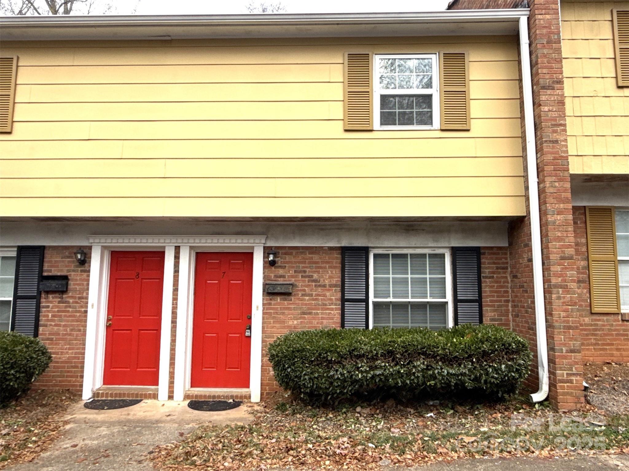 409 Hawley Avenue, Unit 7 Belmont, NC 28012 - Photo 1 of 12 a front view of a house having yard