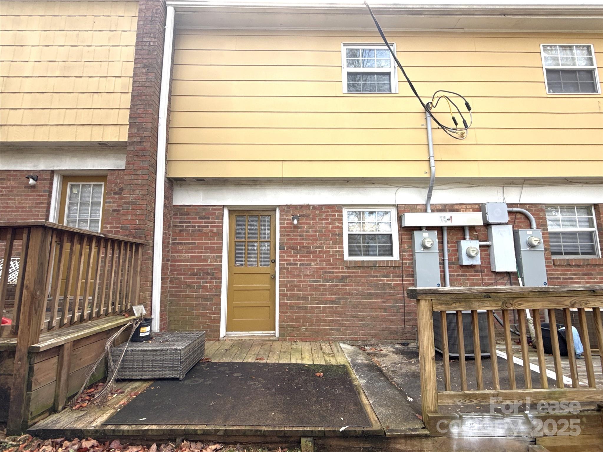 409 Hawley Avenue, Unit 7 Belmont, NC 28012 - Photo 12 of 12 a view of a brick house with a small car