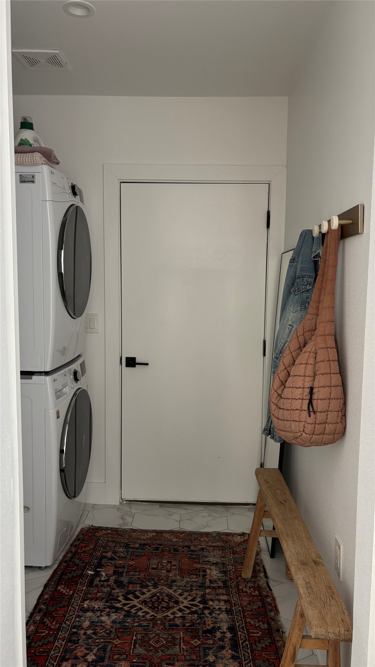 1816 Adina Street, Unit 2 Austin, TX 78721 - Photo 21 of 25 Dedicated laundry area with stacked white appliances