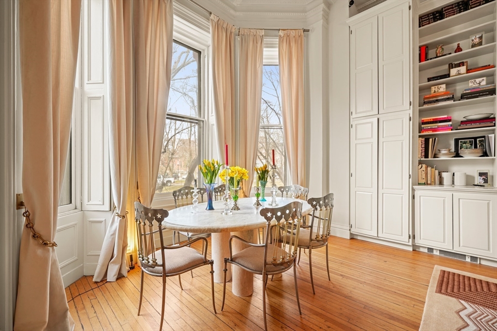 116 Commonwealth Avenue, Unit 1 Boston, MA 02116 - Photo 3 of 27 a view of a dining room with furniture and a window