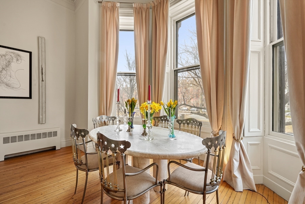 116 Commonwealth Avenue, Unit 1 Boston, MA 02116 - Photo 5 of 27 a view of a dining room with furniture and wooden floor