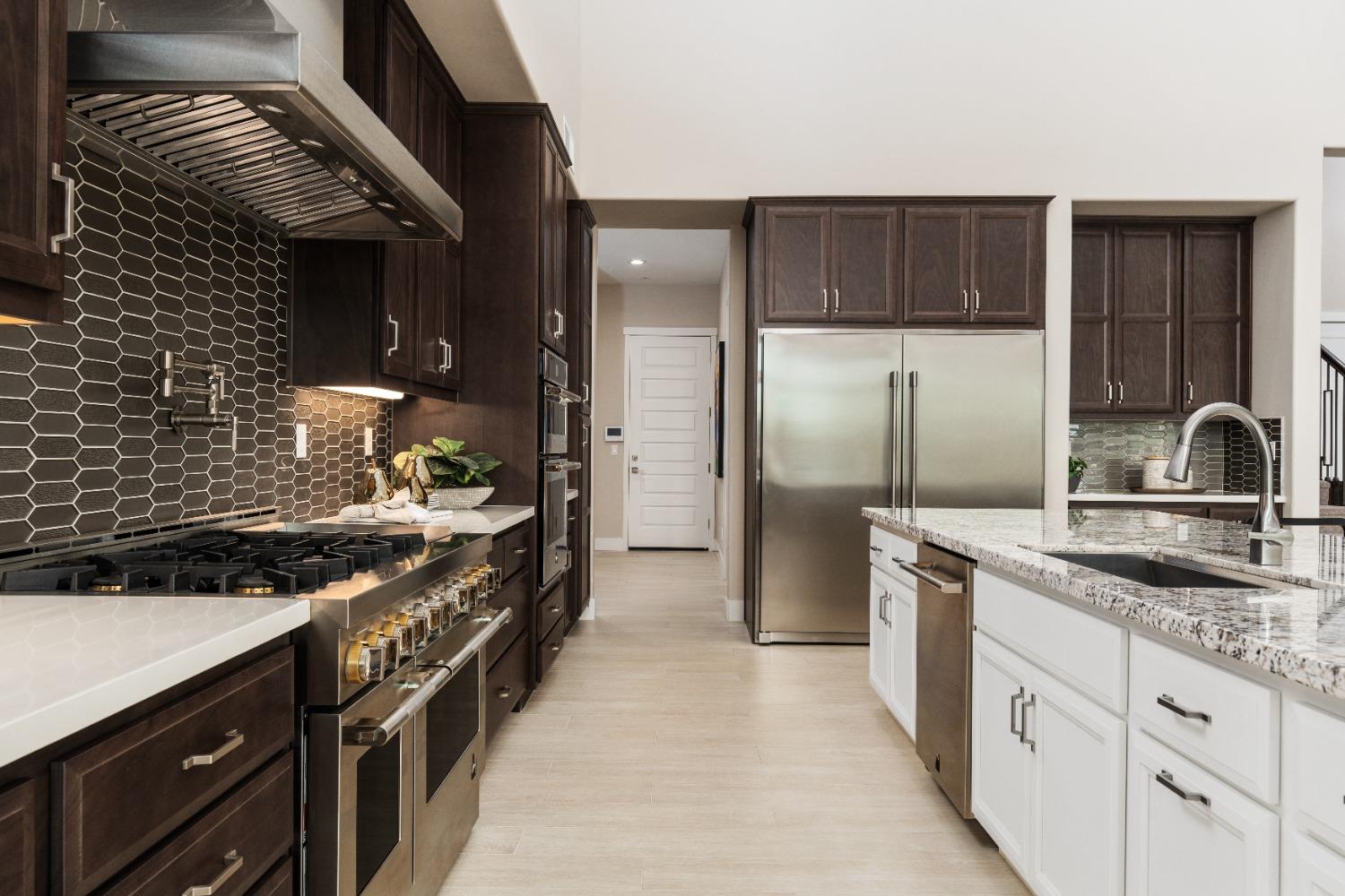 1764 Lester Avenue Clovis, CA 93619 - Photo 11 of 51 a kitchen with stainless steel appliances granite countertop a sink stove and refrigerator