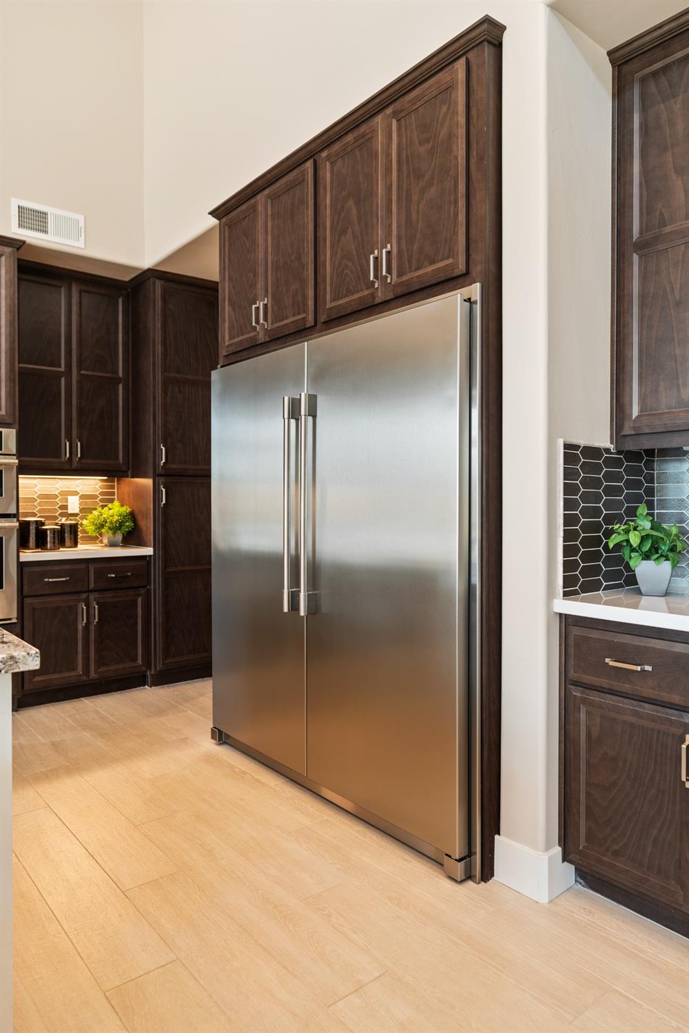 1764 Lester Avenue Clovis, CA 93619 - Photo 18 of 51 a kitchen with stainless steel appliances granite countertop a refrigerator and a stove