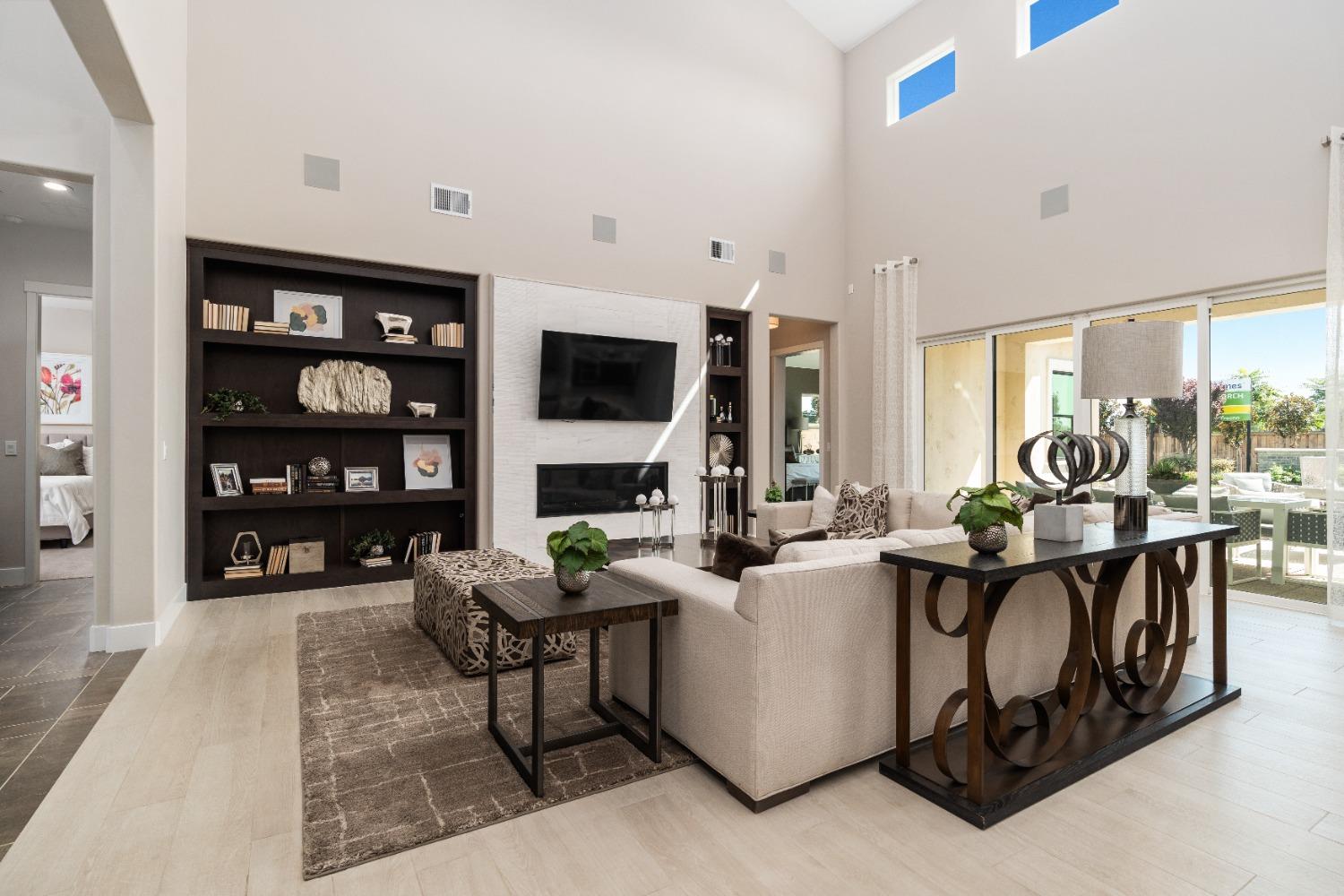 1764 Lester Avenue Clovis, CA 93619 - Photo 26 of 51 a living room with fireplace furniture and a flat screen tv
