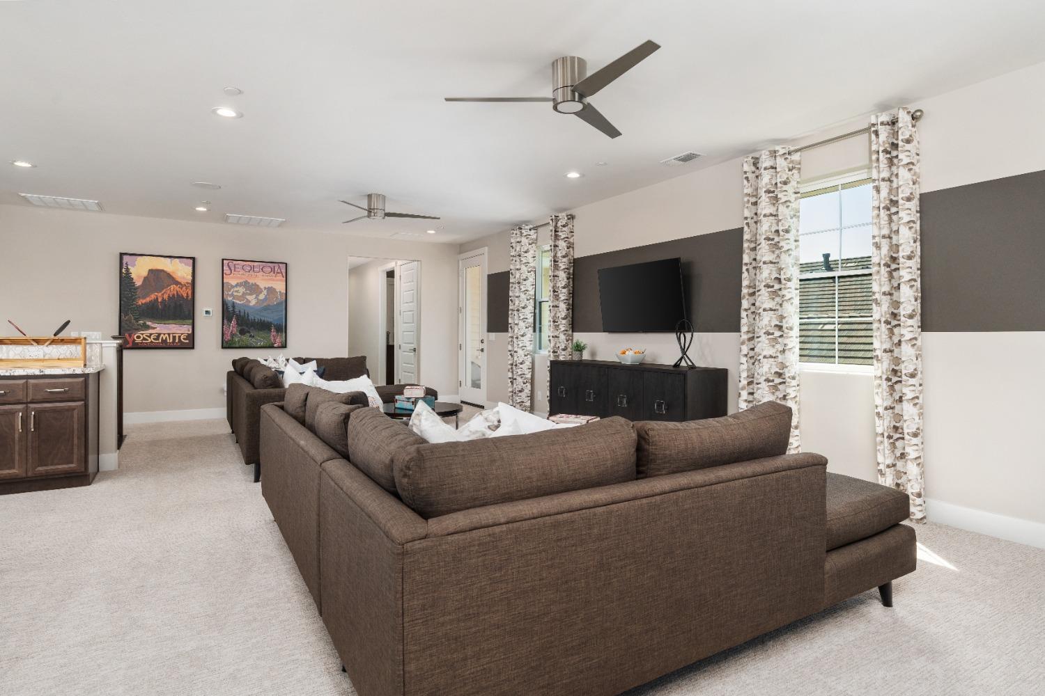 1764 Lester Avenue Clovis, CA 93619 - Photo 28 of 51 a living room with furniture and a flat screen tv