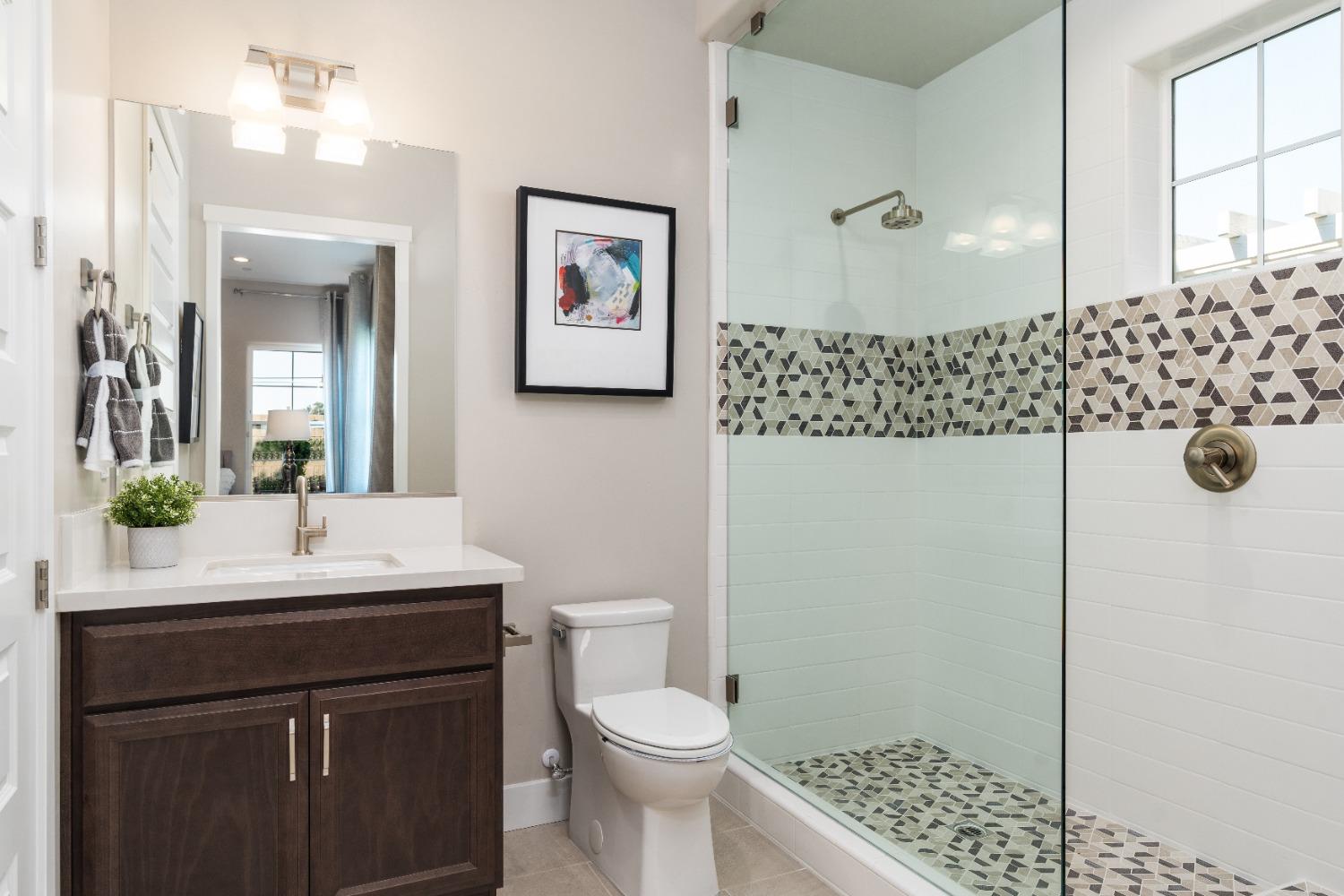 1764 Lester Avenue Clovis, CA 93619 - Photo 32 of 51 a bathroom with a sink a toilet and shower