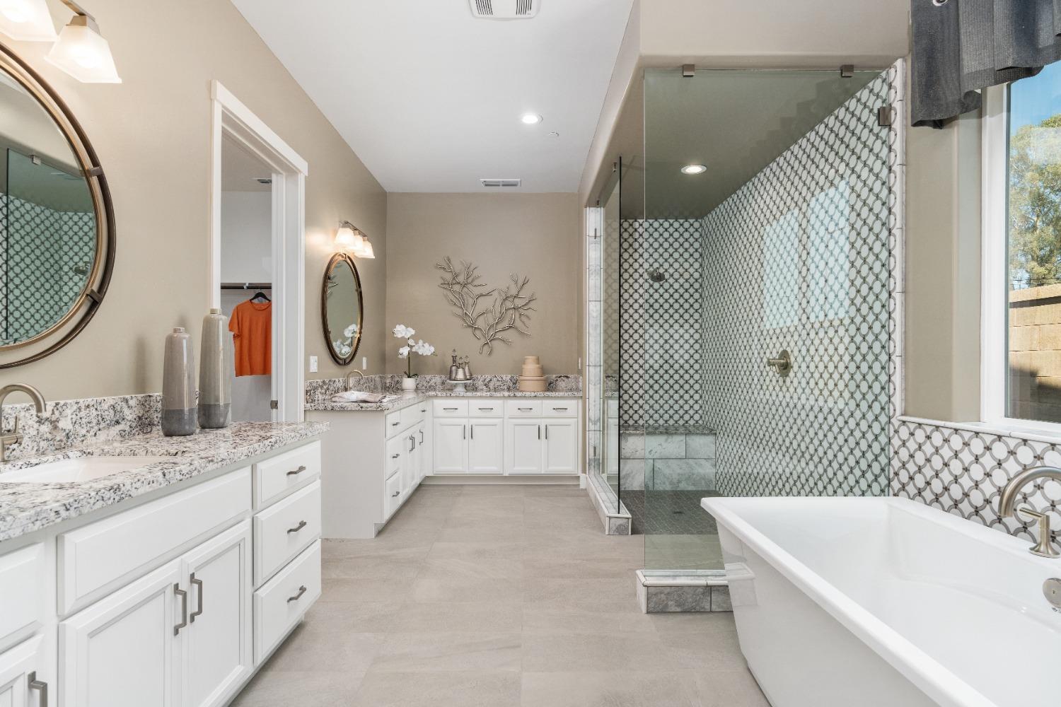 1764 Lester Avenue Clovis, CA 93619 - Photo 33 of 51 a bathroom with a granite countertop sink mirror and bathtub