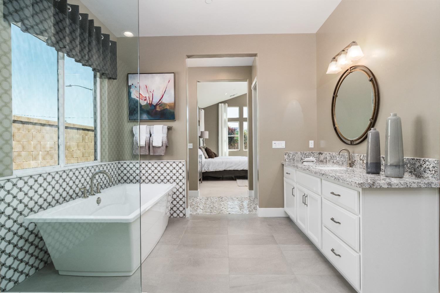 1764 Lester Avenue Clovis, CA 93619 - Photo 34 of 51 a spacious bathroom with a double vanity sink mirror and bathtub