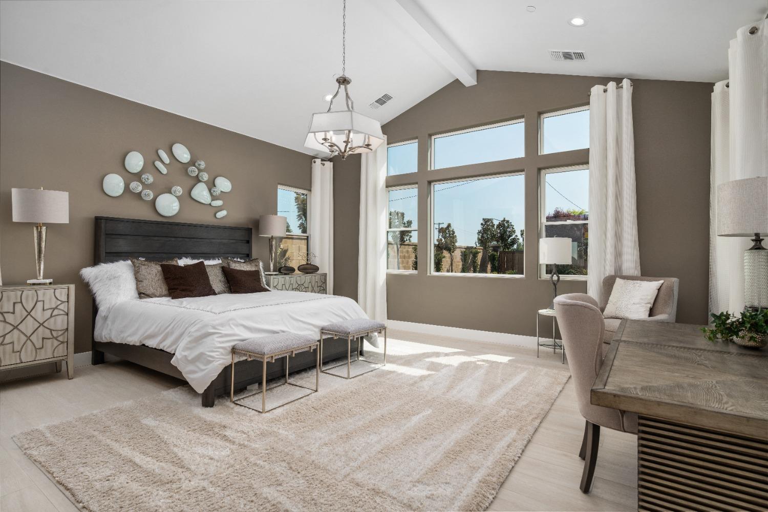 1764 Lester Avenue Clovis, CA 93619 - Photo 40 of 51 a bedroom with a large bed and a chandelier