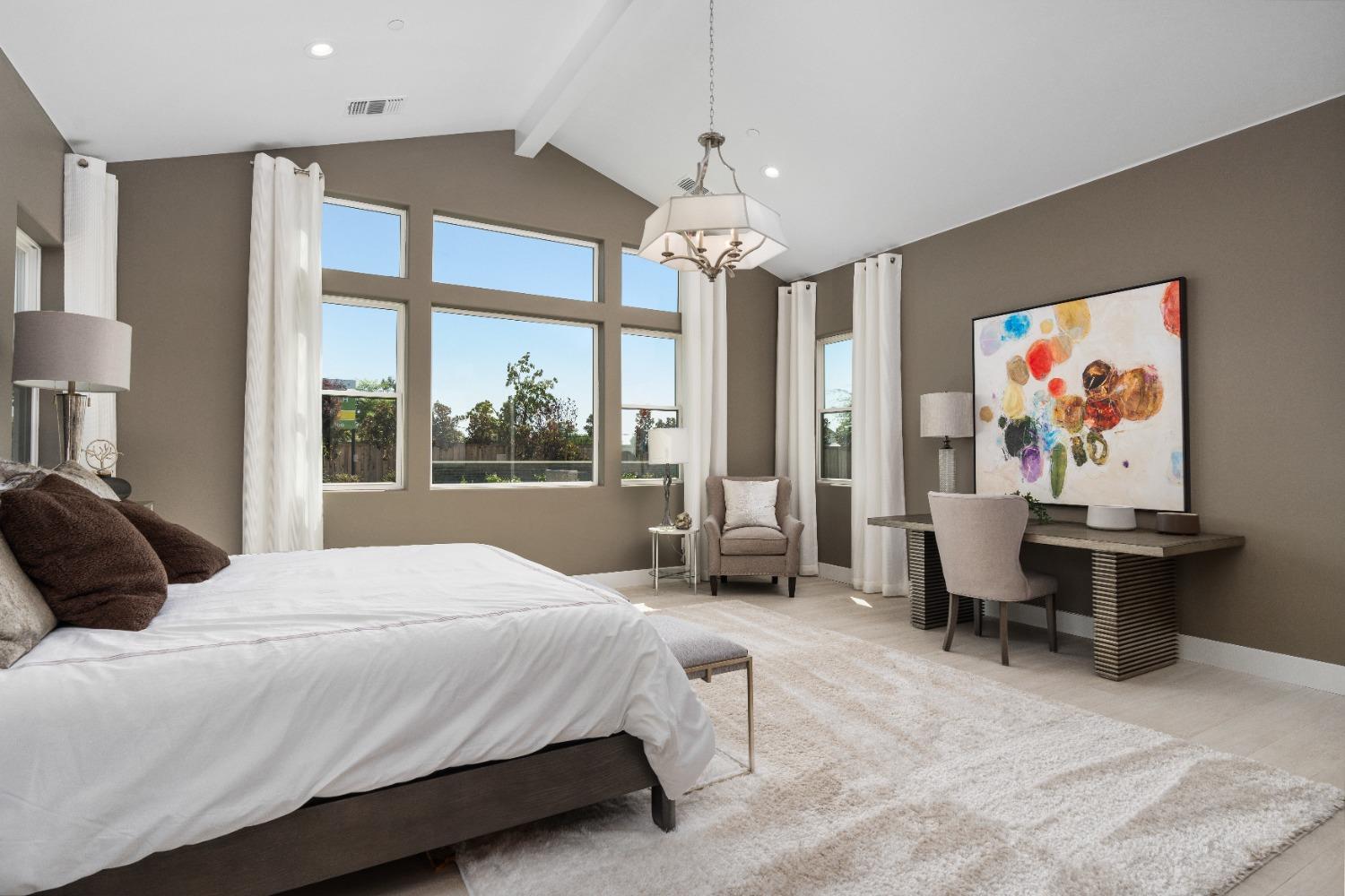 1764 Lester Avenue Clovis, CA 93619 - Photo 41 of 51 a bedroom with a large bed a flat screen tv and a large window