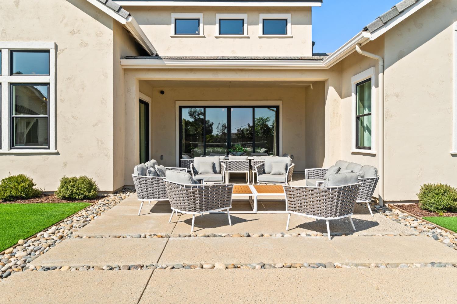 1764 Lester Avenue Clovis, CA 93619 - Photo 50 of 51 a view of a patio with a dining table and chairs with wooden floor