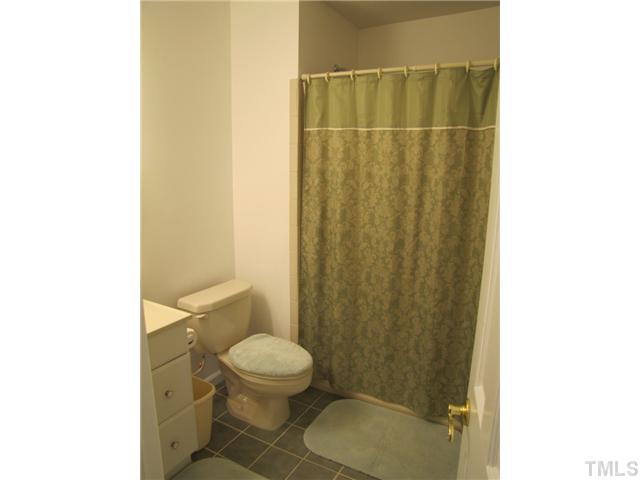 1509 Falls Church Road Raleigh, NC 27609 - Photo 14 of 18 a bathroom with a toilet and a shower