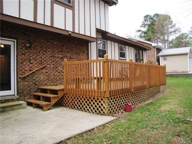 1509 Falls Church Road Raleigh, NC 27609 - Photo 16 of 18 a front view of a house with a fence