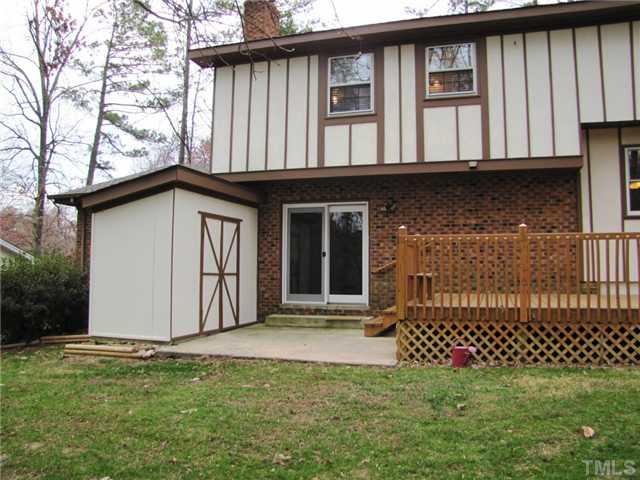 1509 Falls Church Road Raleigh, NC 27609 - Photo 17 of 18 a front view of a house with a garden
