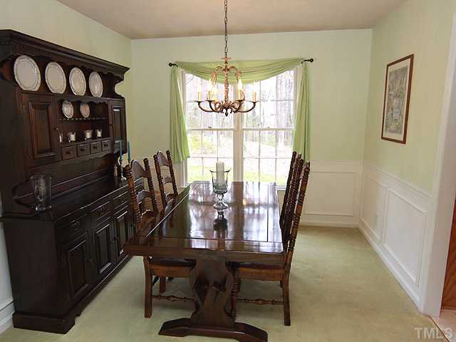 1509 Falls Church Road Raleigh, NC 27609 - Photo 4 of 18 a view of a dining room with furniture window and outside view