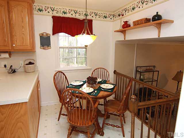 1509 Falls Church Road Raleigh, NC 27609 - Photo 6 of 18 a view of a dining room with furniture and window