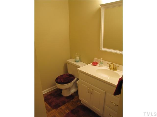 1509 Falls Church Road Raleigh, NC 27609 - Photo 10 of 18 a bathroom with a sink and a toilet