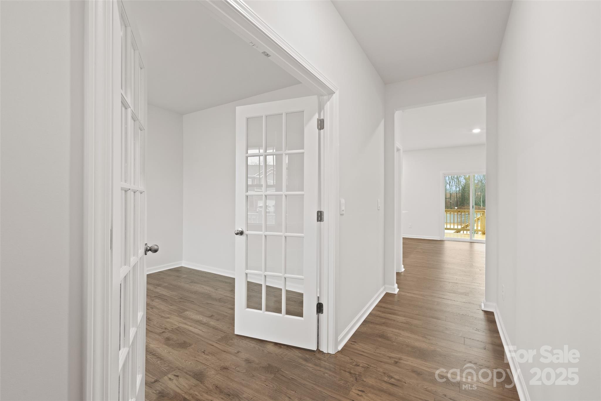 198 Shorthorn Road Fletcher, NC 28732 - Photo 11 of 20 a view of a hallway with wooden floor and staircase