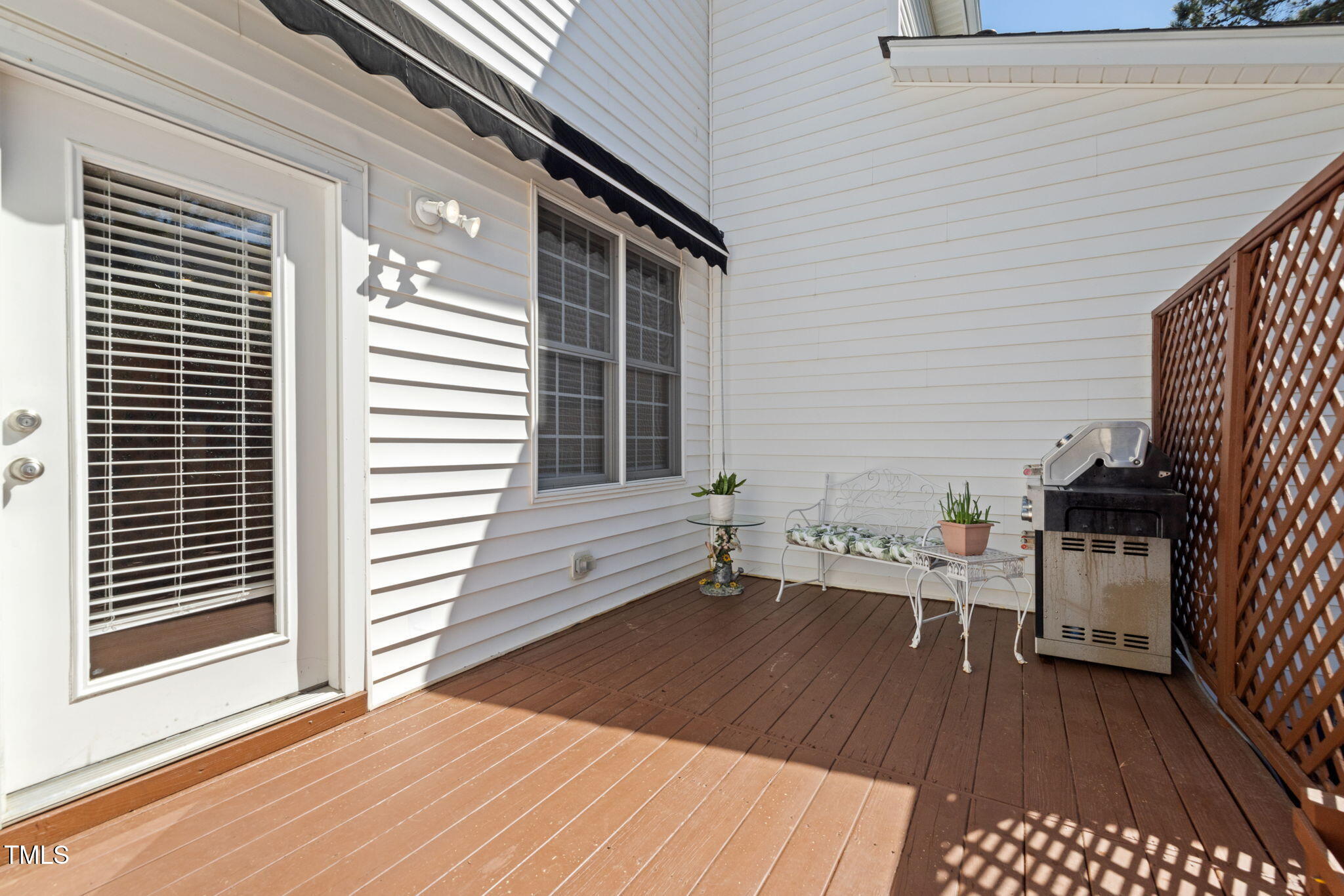 5569 Sea Daisy Drive Raleigh, NC 27606 - Photo 20 of 31 a view of a patio with wooden floor