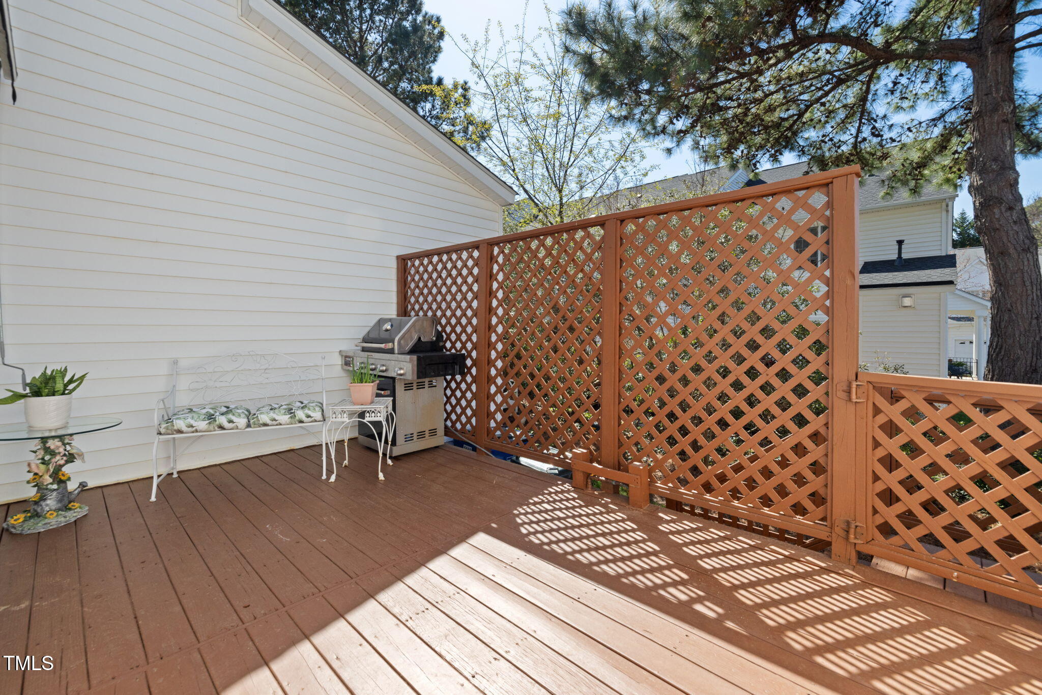 5569 Sea Daisy Drive Raleigh, NC 27606 - Photo 21 of 31 a view of a terrace with wooden floor and bench