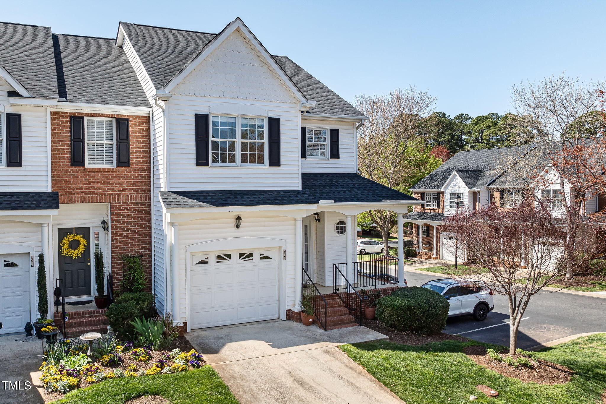 5569 Sea Daisy Drive Raleigh, NC 27606 - Photo 29 of 31 a front view of a house with garden