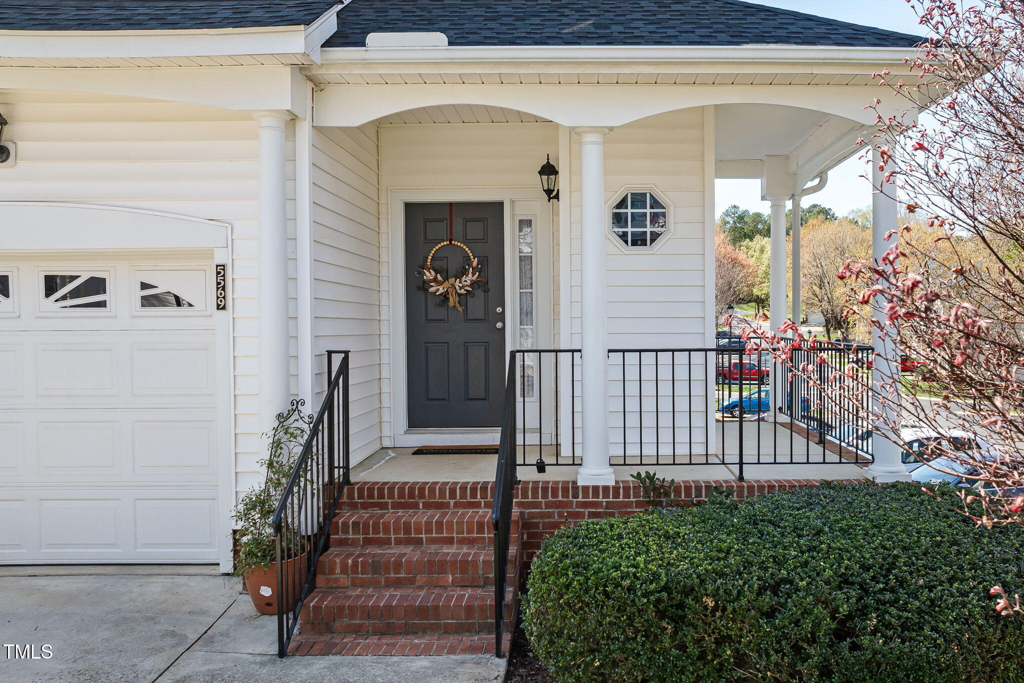 5569 Sea Daisy Drive Raleigh, NC 27606 - Photo 3 of 31 a view of front door of house and stairs