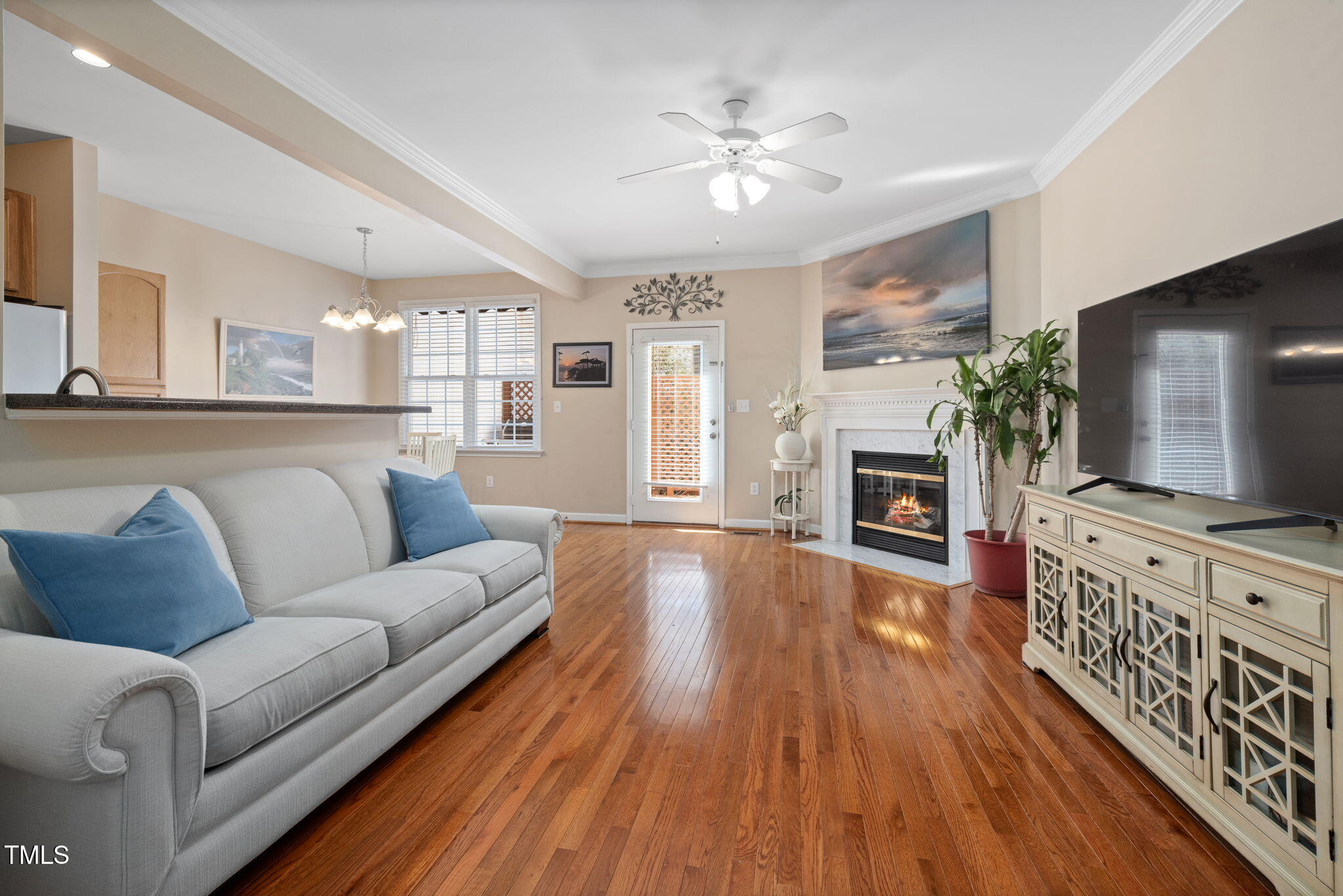 5569 Sea Daisy Drive Raleigh, NC 27606 - Photo 5 of 31 a living room with fireplace furniture and a flat screen tv