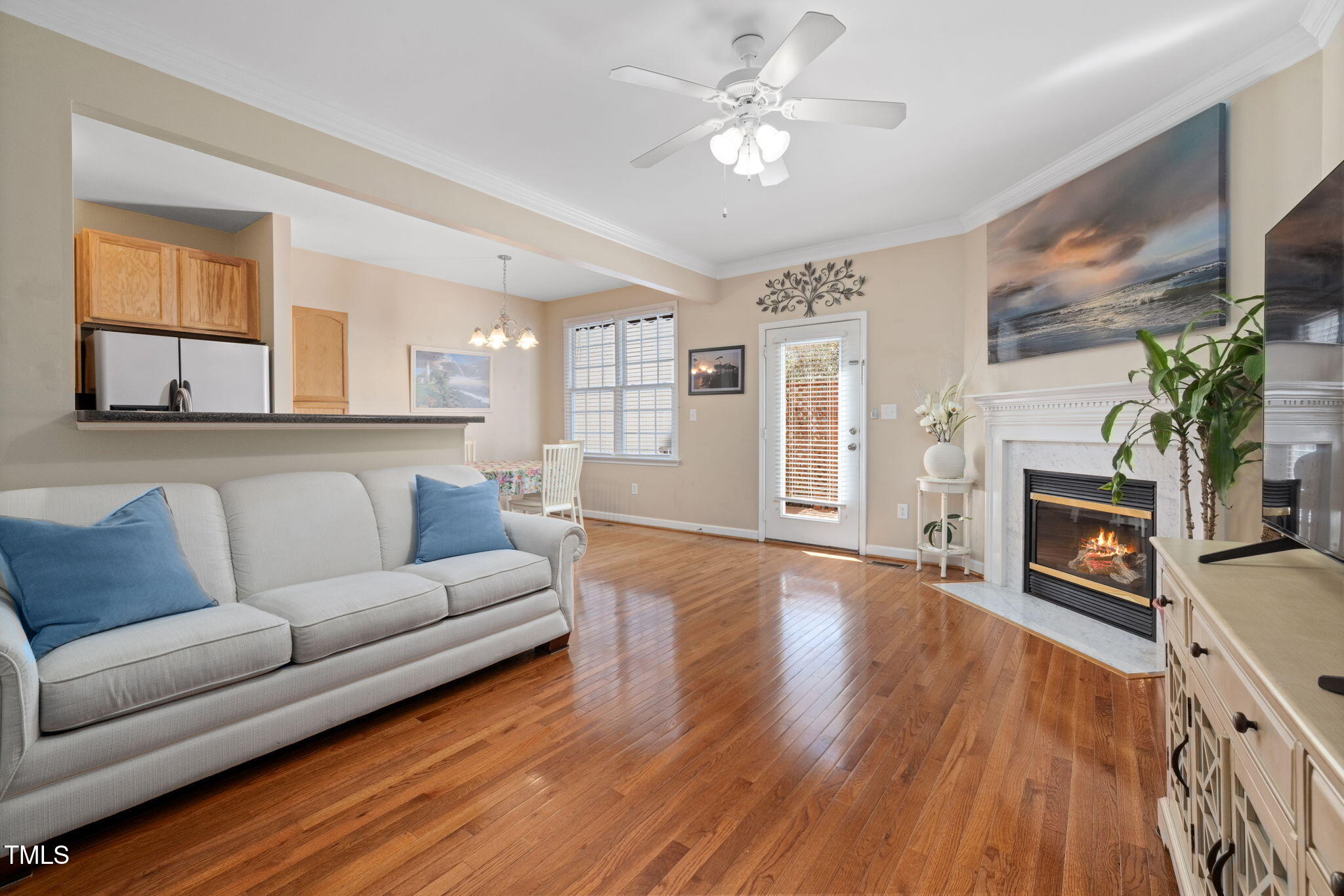 5569 Sea Daisy Drive Raleigh, NC 27606 - Photo 6 of 31 a living room with furniture fireplace and flat screen tv