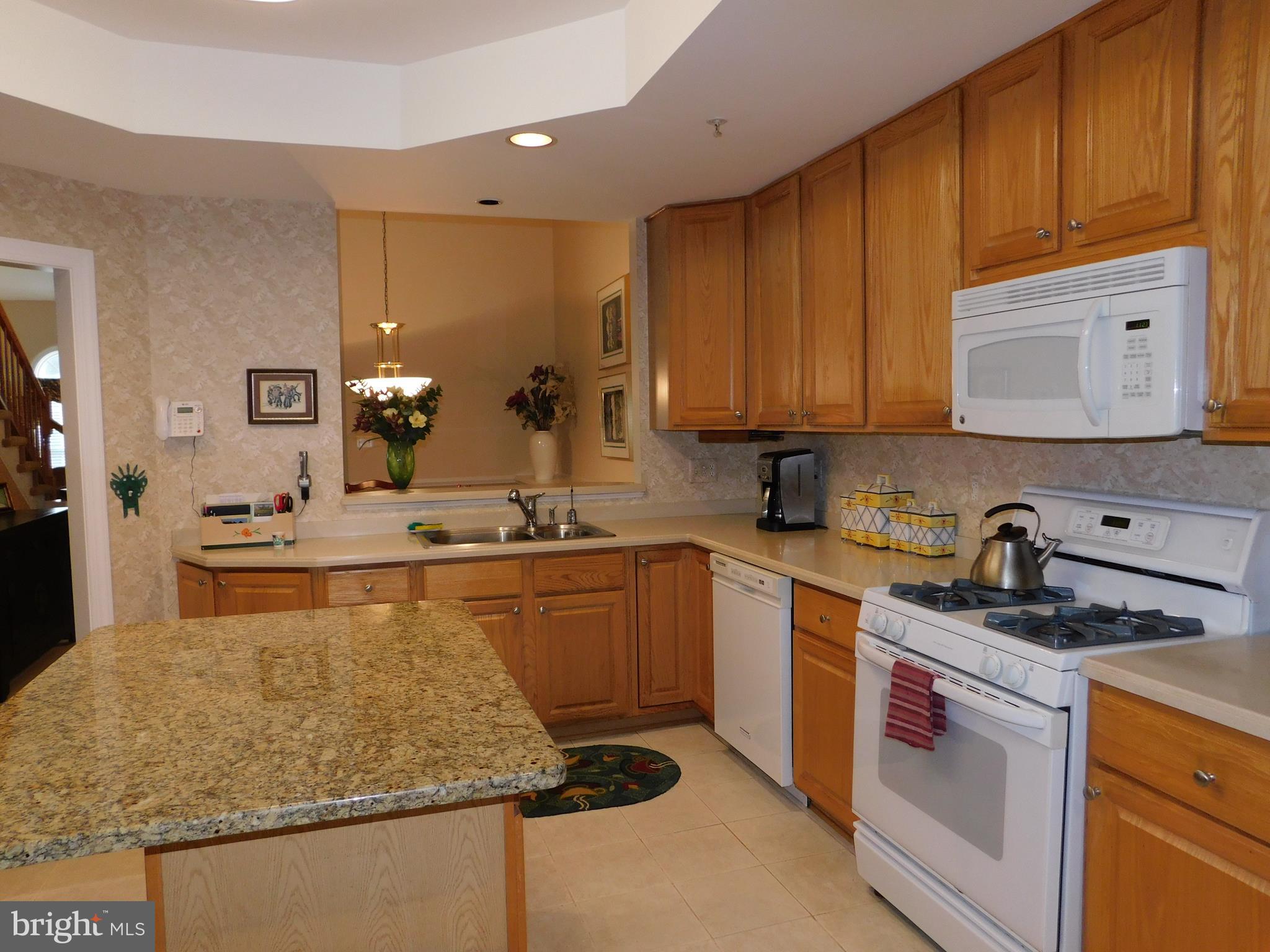 309 Colony Point Place Edgewater, MD 21037 - Photo 4 of 17 Spacious Kitchen with island, tray ceiling, pantry