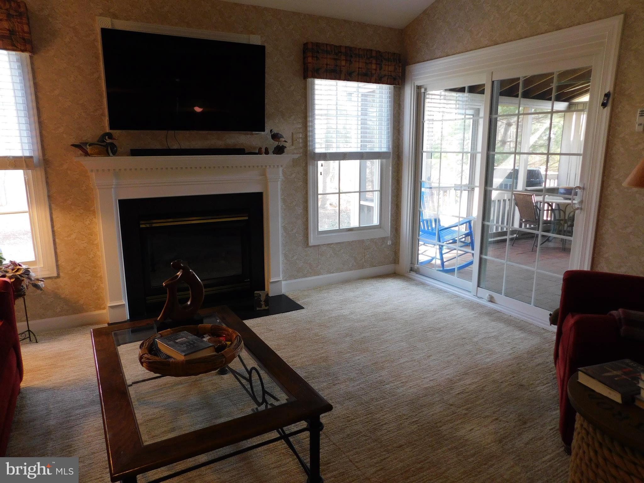 309 Colony Point Place Edgewater, MD 21037 - Photo 6 of 17 Sunroom with gas fireplace, & sliders to porch