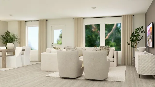 a living room with furniture and large windows