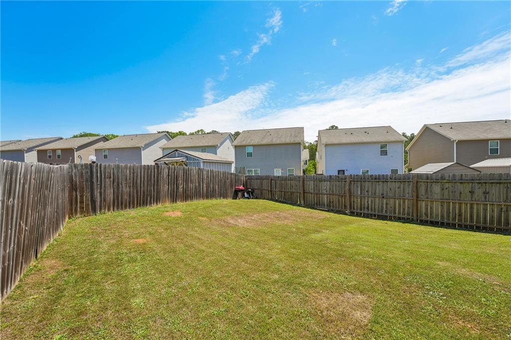 10933 Wheeler Trace Hampton, GA 30228 - Photo 19 of 22 a view of a backyard
