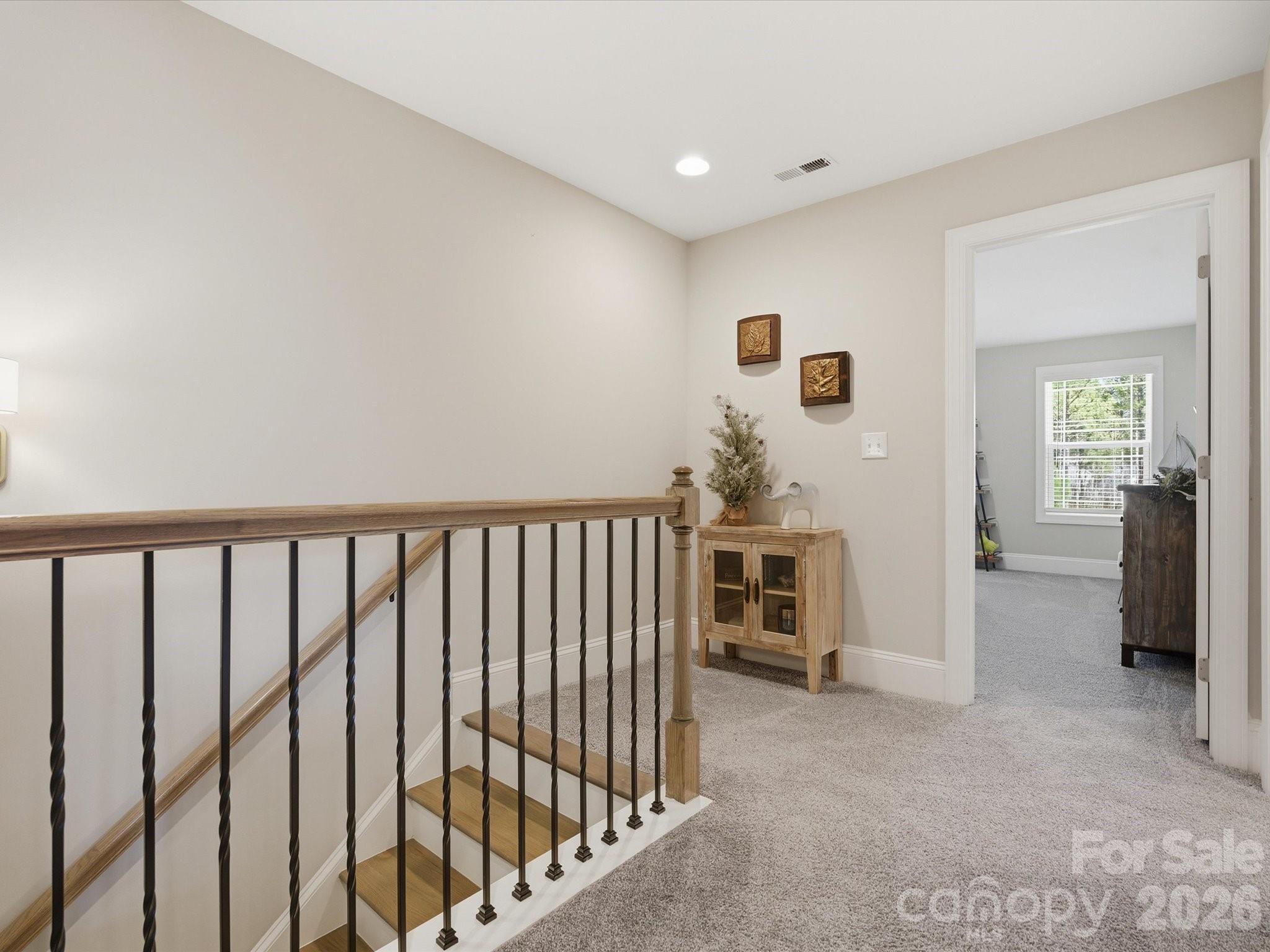 4166 Persimmon Road Lancaster, SC 29720 - Photo 26 of 41 a view of a hallway with furniture and staircase