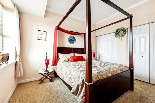 a bed room with a bed and a window