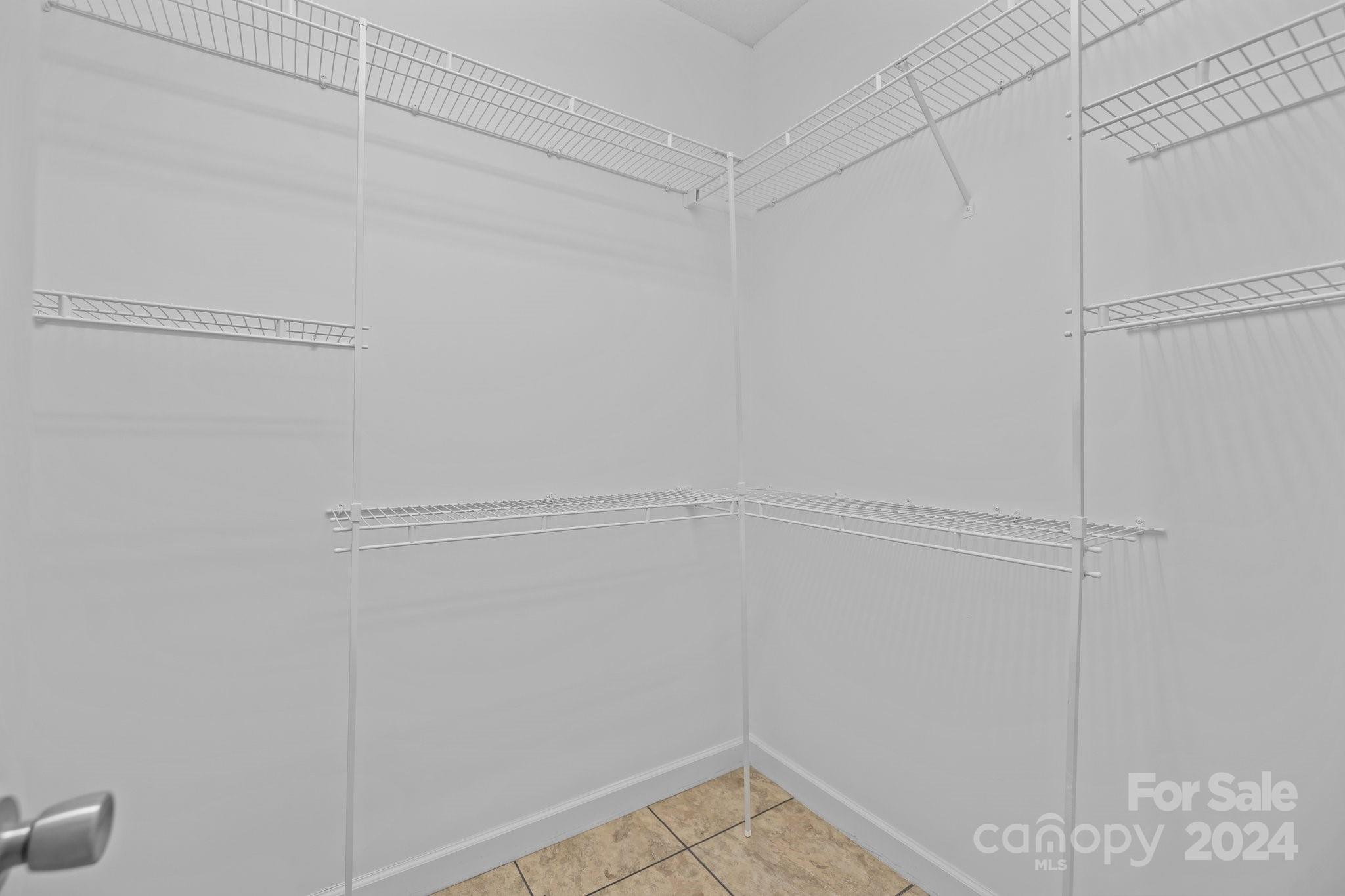 10508 Misty Ridge Lane Charlotte, NC 28277 - Photo 16 of 32 a view of a room with racks on the wall