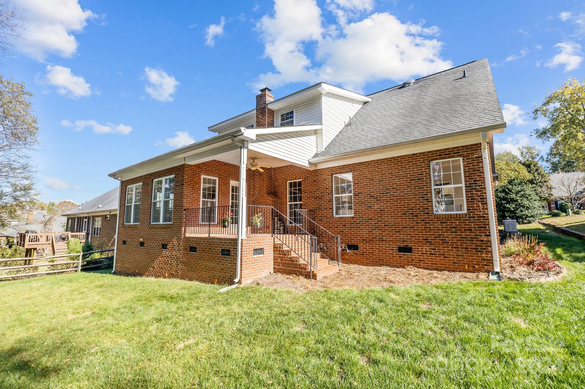 10508 Misty Ridge Lane Charlotte, NC 28277 - Photo 30 of 32 a view of a house with a yard