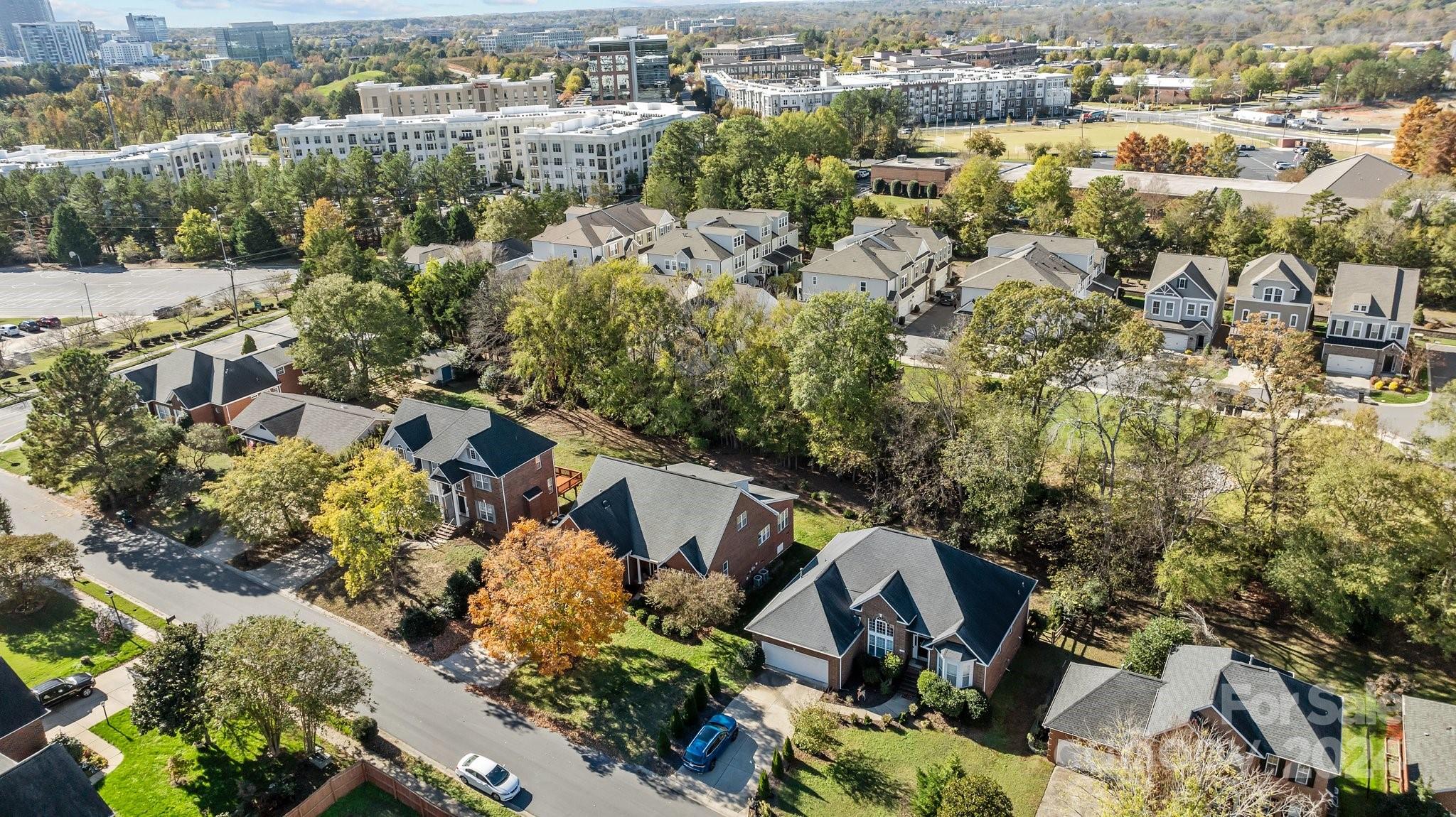 10508 Misty Ridge Lane Charlotte, NC 28277 - Photo 31 of 32 an aerial view of a house with a yard and lake view