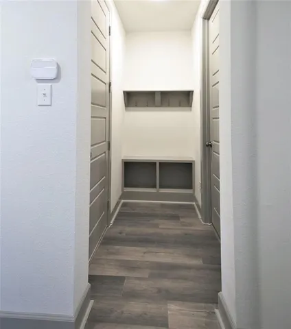 a view of backyard with tub and fence