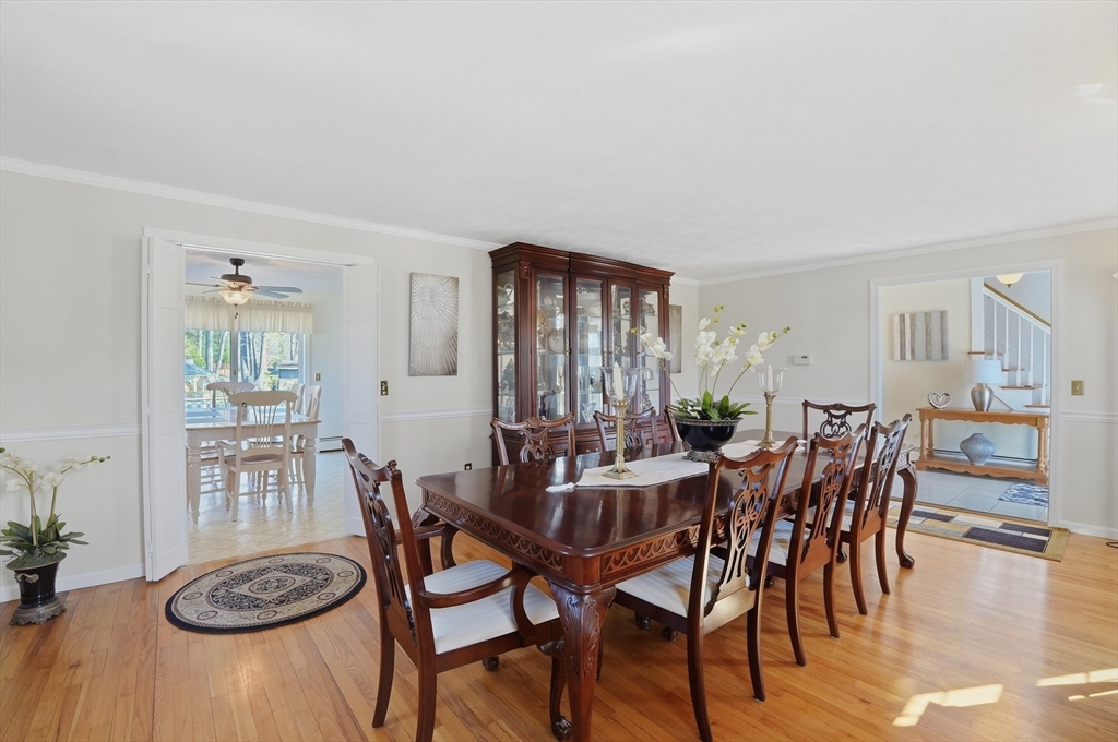 54 Sagamore Road Seekonk, MA 02771 - Photo 12 of 35 a view of a dining room with furniture and wooden floor