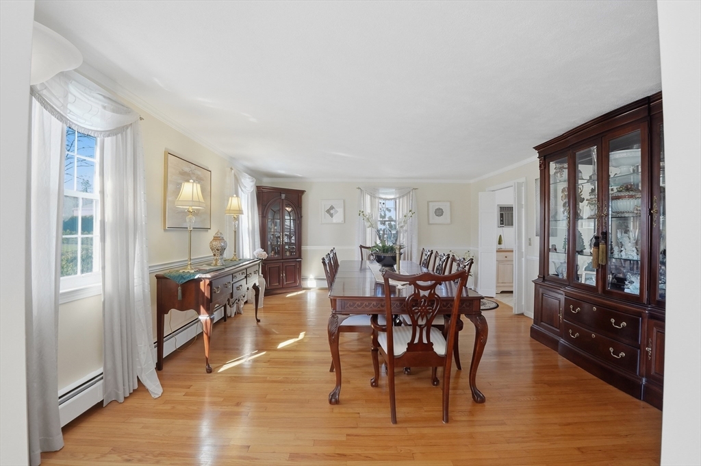 54 Sagamore Road Seekonk, MA 02771 - Photo 13 of 35 a view of a dining room with furniture window and wooden floor