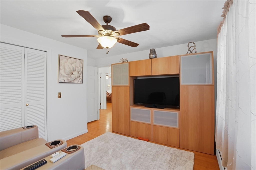 54 Sagamore Road Seekonk, MA 02771 - Photo 19 of 35 a living room with a flat screen tv