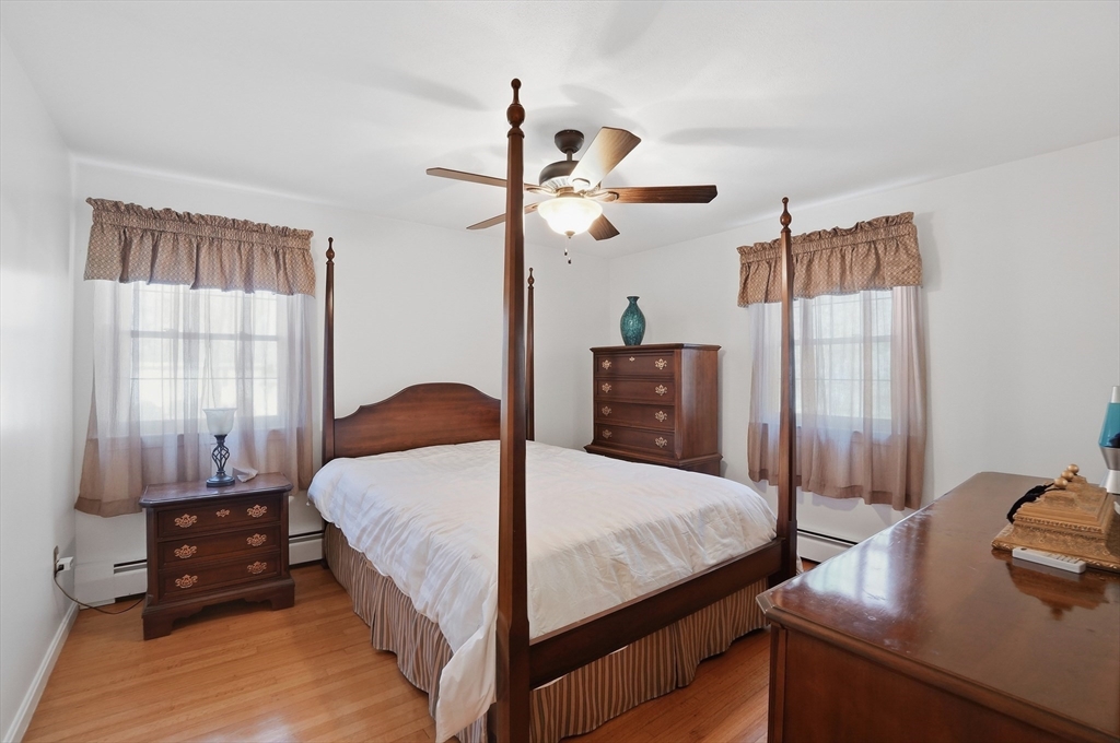 54 Sagamore Road Seekonk, MA 02771 - Photo 27 of 35 a bedroom with a bed and wooden floor