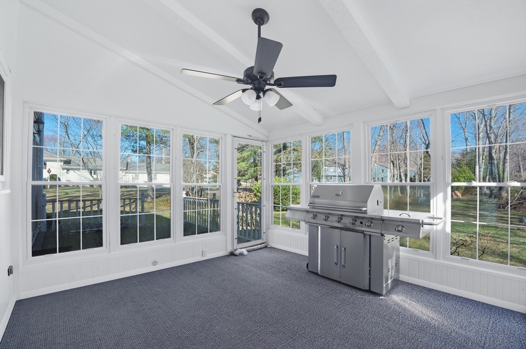 54 Sagamore Road Seekonk, MA 02771 - Photo 29 of 35 a view of a kitchen with furniture large windows and stainless steel appliances