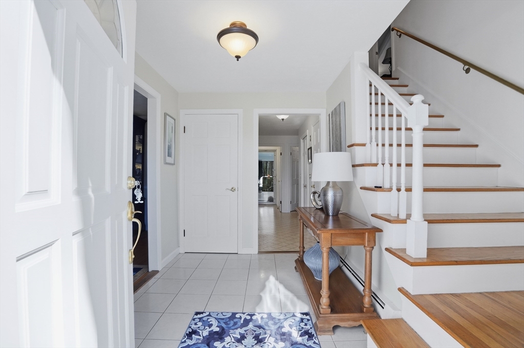 54 Sagamore Road Seekonk, MA 02771 - Photo 3 of 35 a view of entryway with wooden floor and a front door