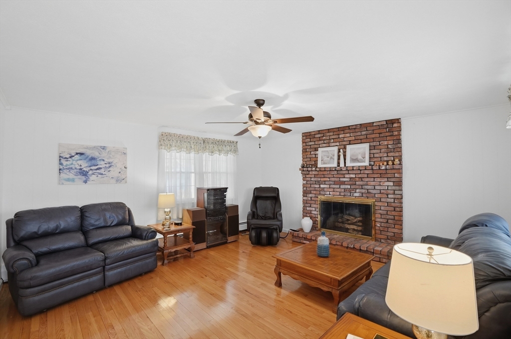 54 Sagamore Road Seekonk, MA 02771 - Photo 7 of 35 a living room with furniture fireplace and window