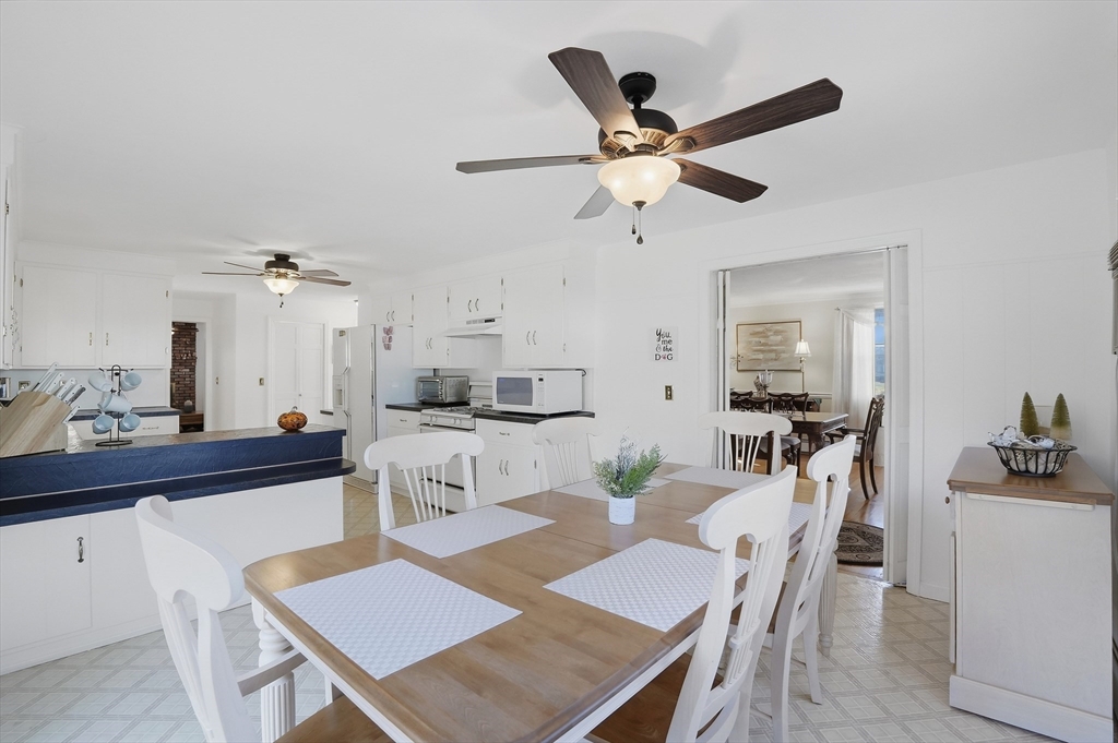 54 Sagamore Road Seekonk, MA 02771 - Photo 9 of 35 a view of a dining room with furniture and a chandelier fan