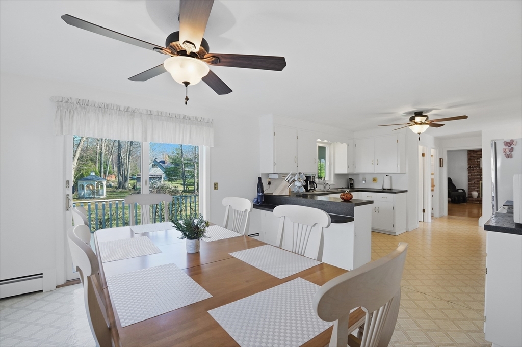 54 Sagamore Road Seekonk, MA 02771 - Photo 10 of 35 a view of a dining room with furniture window and wooden floor