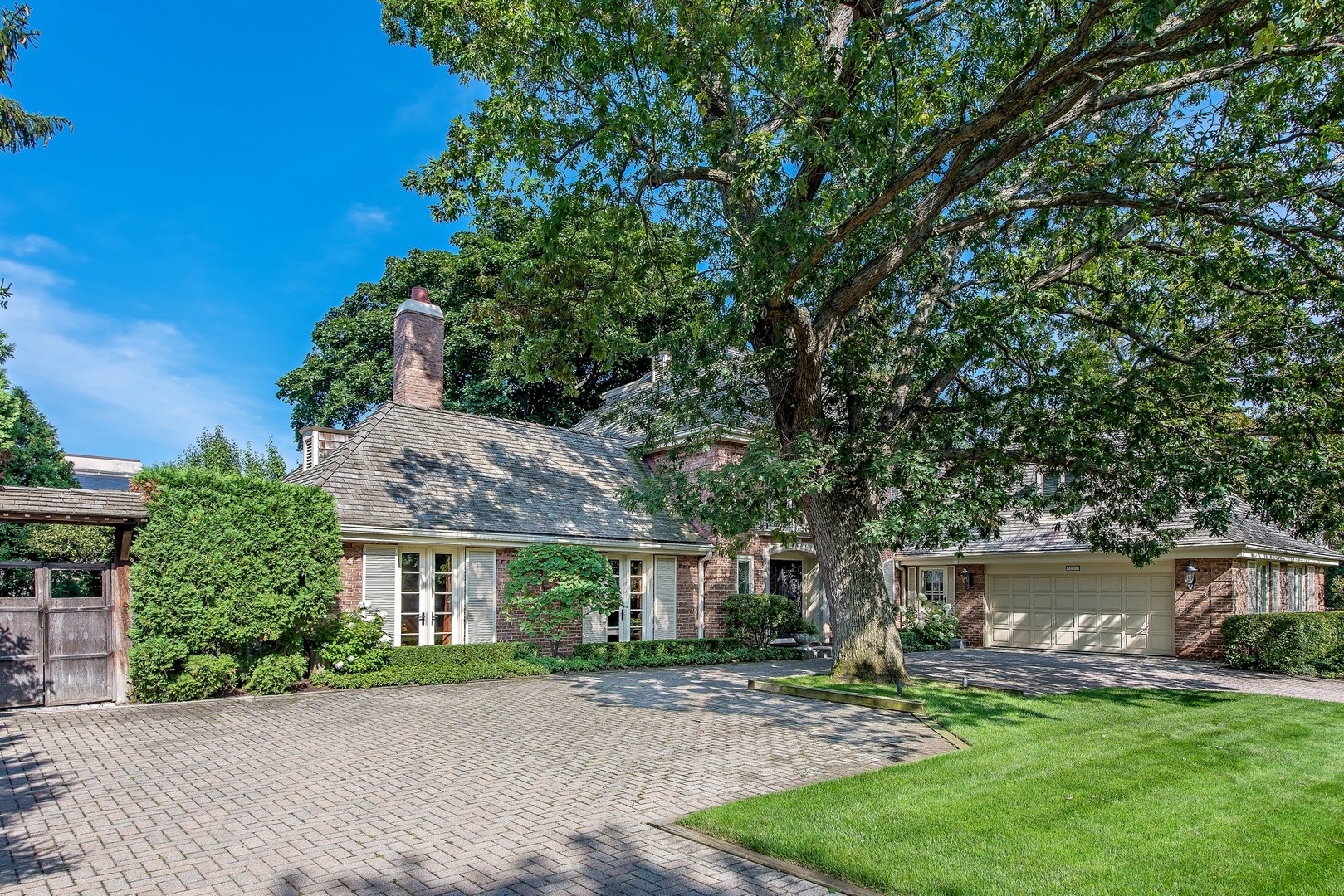 499 Sheridan Road Winnetka, IL 60093 - Photo 2 of 33 front view of a house with a yard