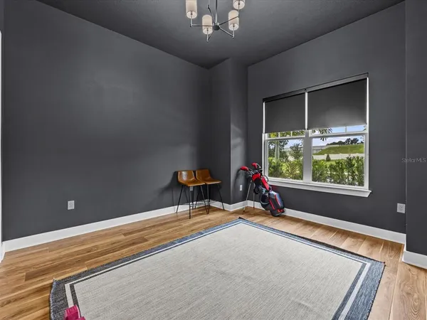 a bed room with a bed and a window