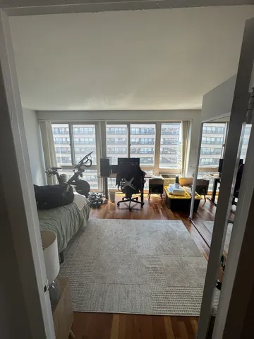 a living room with furniture and a large window